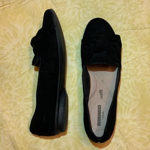 Black suede Clarks flats with bows